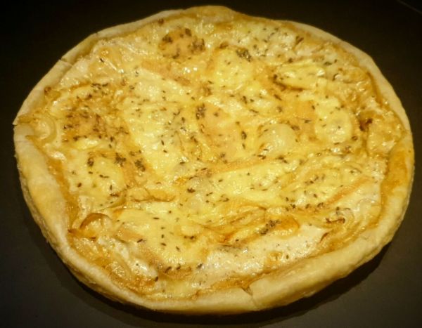 Recette de tarte au munster au cumin aux oignons caramélisés. Excellent !