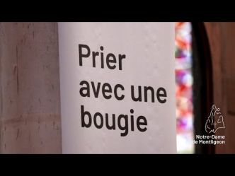 Déposer une bougie aux pieds de Notre-Dame de Montligeon